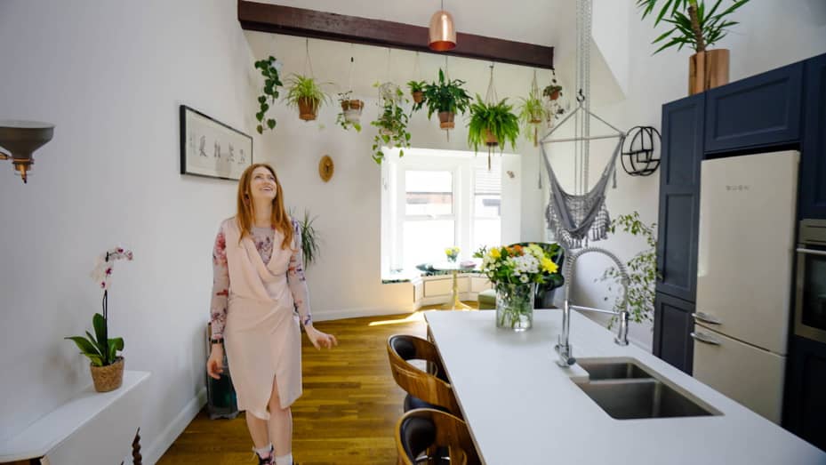 The open kitchen and living area is one of my favorite places in the house. The natural light makes it the perfect spot for my plants to thrive.